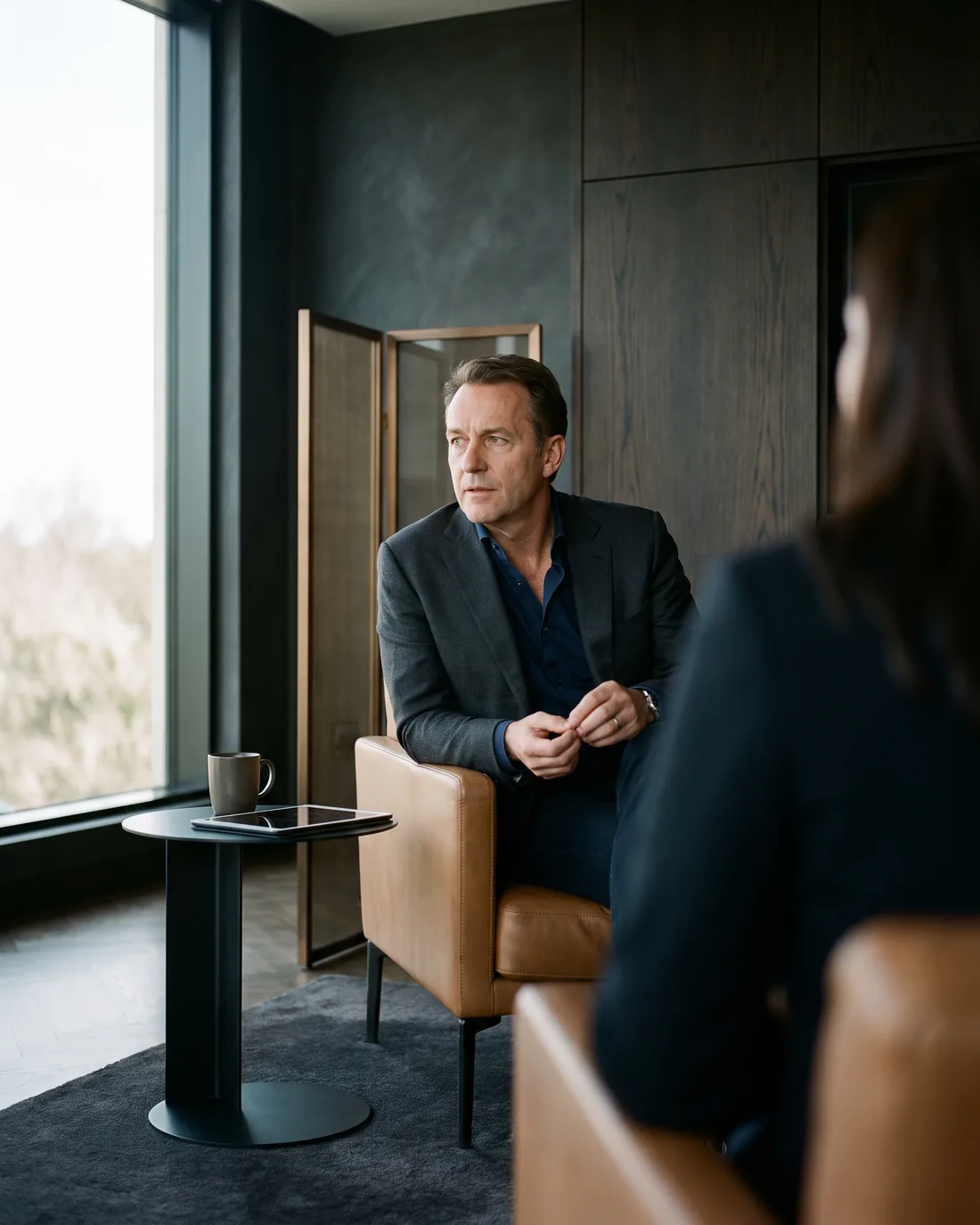A senior CHRO reviewing the work in a calm San Diego boardroom